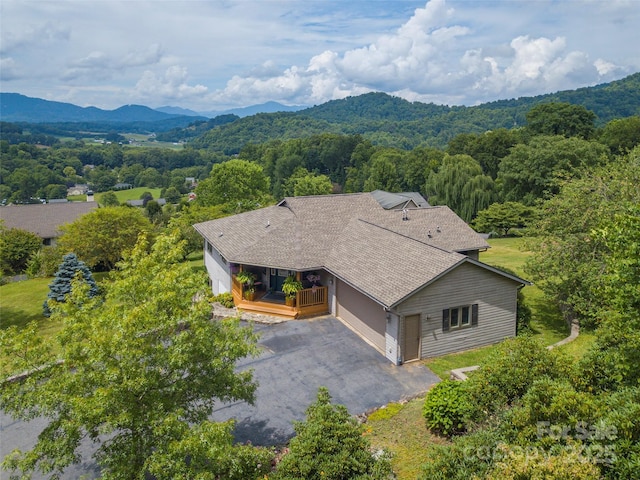 birds eye view of property featuring a mountain view