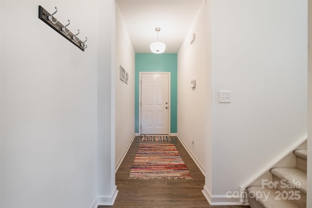 corridor featuring dark hardwood / wood-style flooring