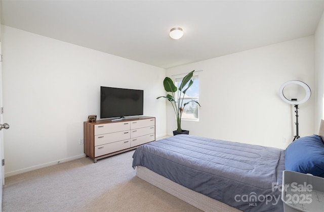 bedroom with light colored carpet