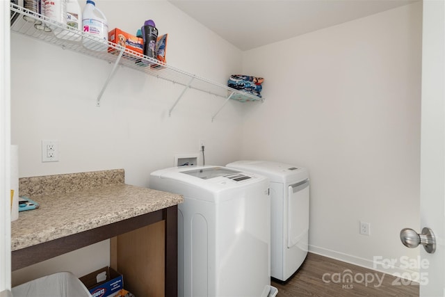 laundry area featuring dark hardwood / wood-style floors and washing machine and clothes dryer