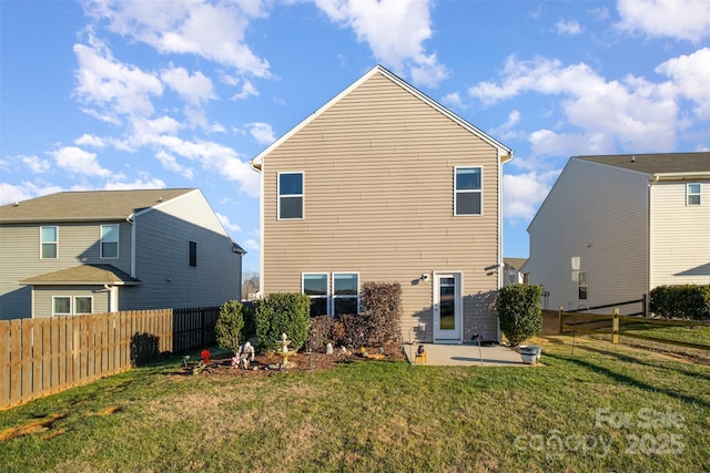 back of property featuring a lawn and a patio