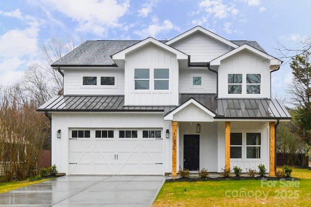 modern inspired farmhouse with a garage