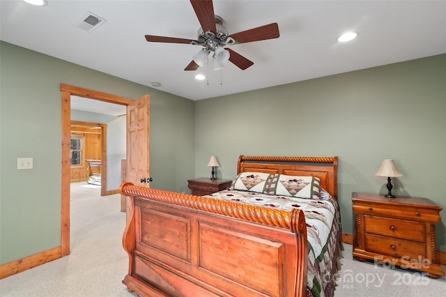 bedroom featuring light carpet and ceiling fan