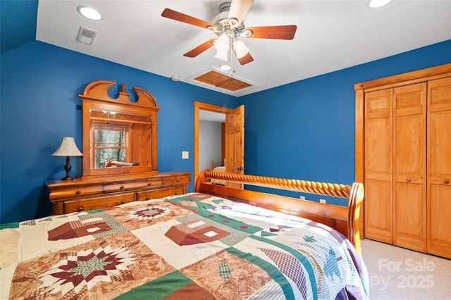 bedroom featuring ceiling fan, vaulted ceiling, and light carpet