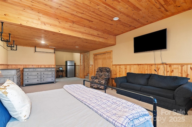 carpeted bedroom with stainless steel fridge and wooden ceiling