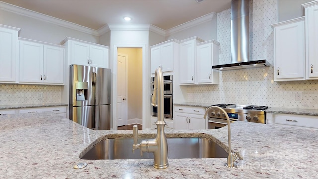 kitchen featuring backsplash, white cabinets, crown molding, wall chimney exhaust hood, and stainless steel appliances