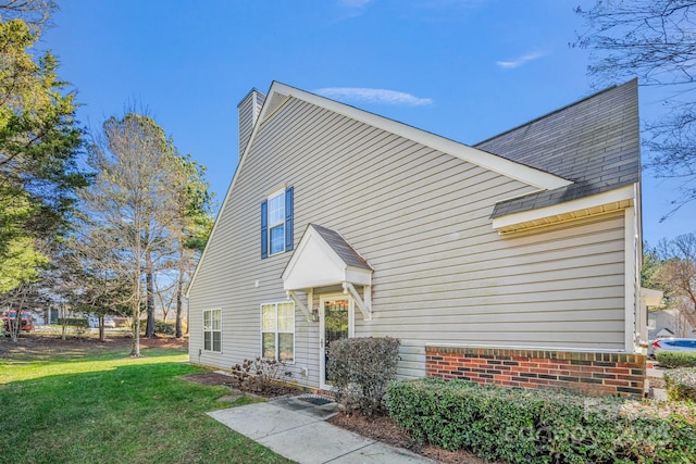 view of home's exterior featuring a yard