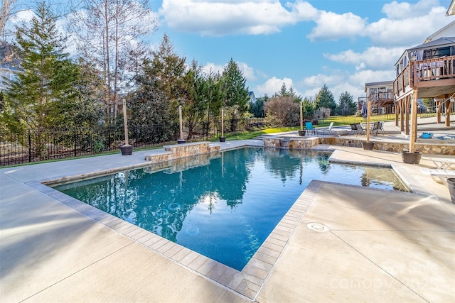 view of swimming pool featuring a patio area