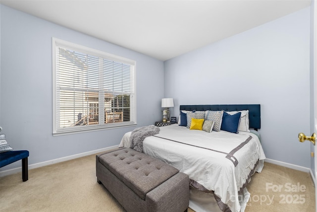 bedroom featuring light carpet