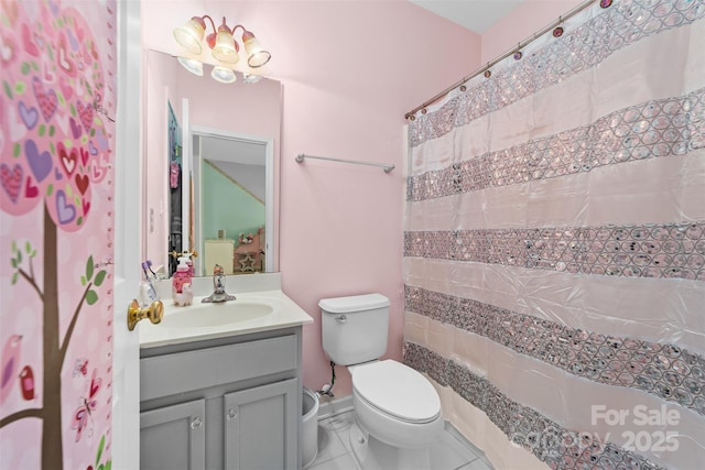 bathroom featuring toilet, vanity, tile patterned flooring, and walk in shower