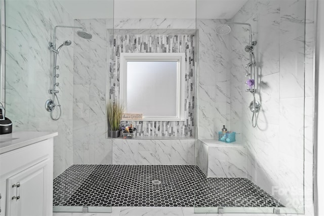 bathroom featuring vanity and a tile shower