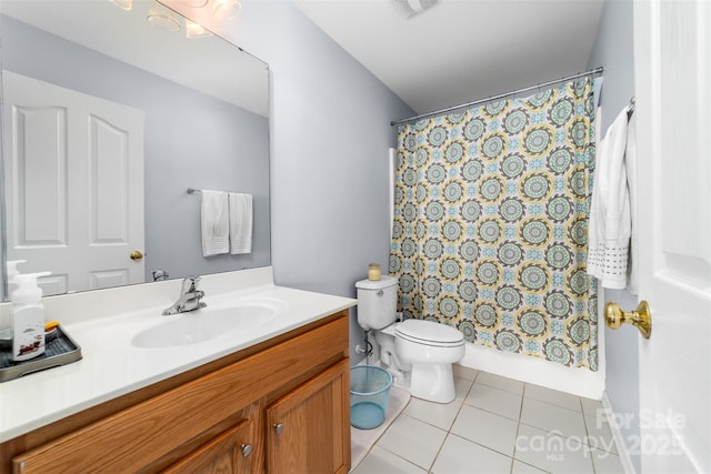 bathroom with toilet, vanity, tile patterned flooring, and a shower with shower curtain