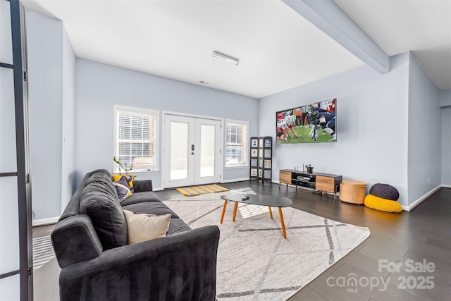 living room with french doors, dark hardwood / wood-style flooring, and beamed ceiling