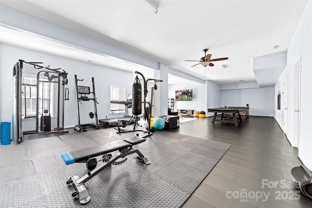 exercise room with ceiling fan