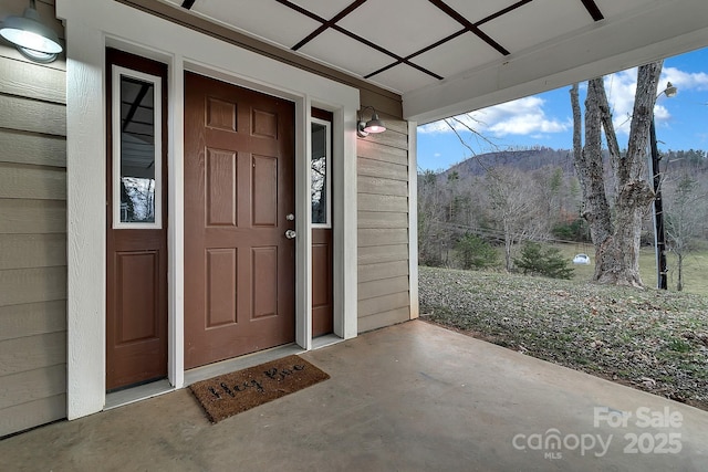 entrance to property featuring covered porch