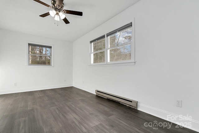 unfurnished room with dark hardwood / wood-style flooring, plenty of natural light, a baseboard heating unit, and ceiling fan