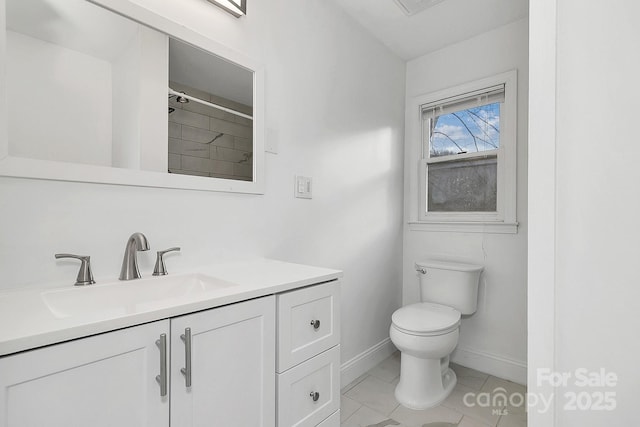 bathroom with tile patterned floors, vanity, toilet, and walk in shower