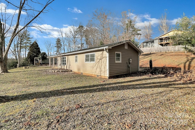 view of property exterior featuring a lawn