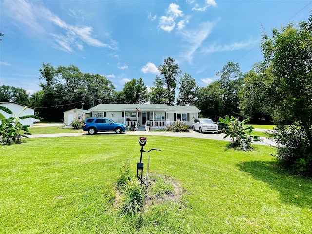 view of front of home with covered porch and a front yard