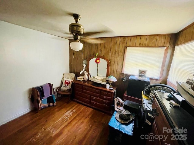 interior space with dark hardwood / wood-style floors and ceiling fan