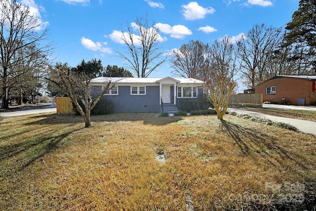 ranch-style home with a front lawn