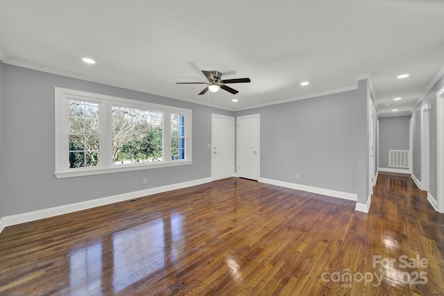 spare room with ornamental molding, dark hardwood / wood-style floors, and ceiling fan