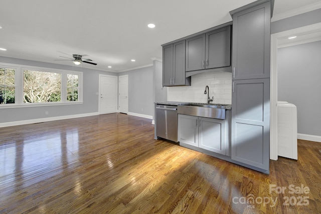 kitchen with gray cabinets, dishwasher, sink, backsplash, and dark hardwood / wood-style flooring