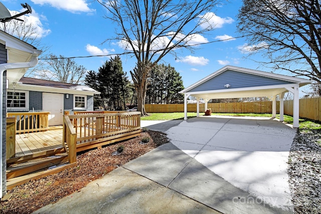 exterior space featuring a wooden deck and a carport