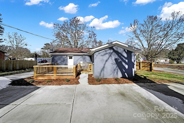 view of front of property with a wooden deck