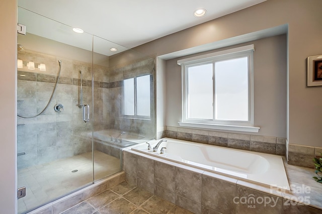 bathroom featuring tile patterned flooring and plus walk in shower