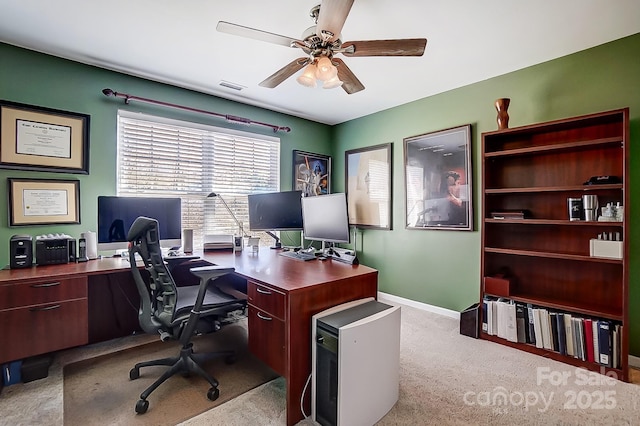 office area with light colored carpet and ceiling fan