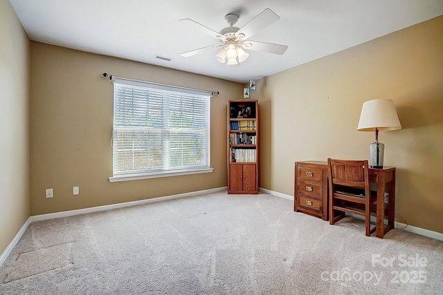 office area with light carpet and ceiling fan