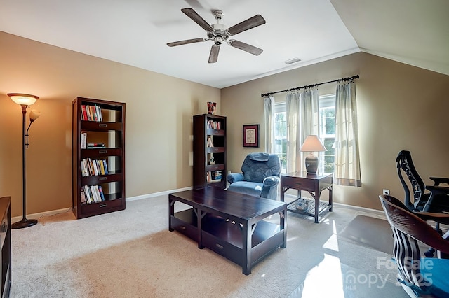 carpeted office with lofted ceiling and ceiling fan