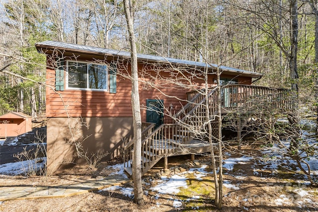 view of property exterior featuring a deck