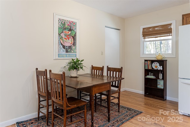 dining area with hardwood / wood-style floors