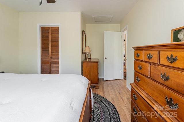 bedroom featuring a closet and light hardwood / wood-style flooring