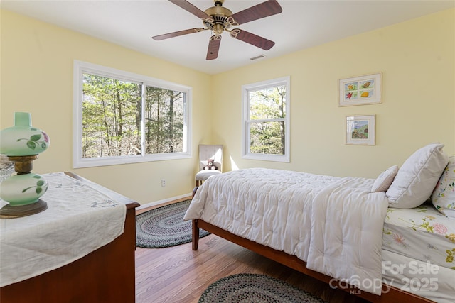 bedroom featuring ceiling fan and hardwood / wood-style floors