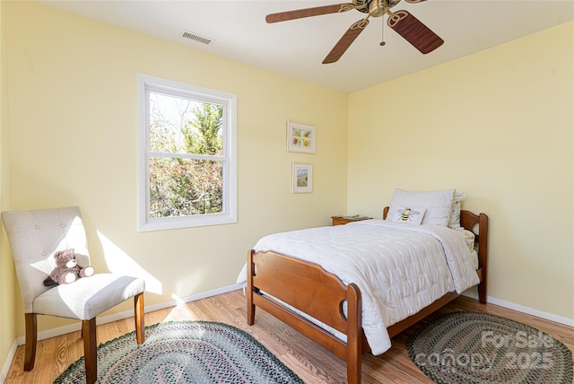 bedroom featuring ceiling fan and light hardwood / wood-style flooring