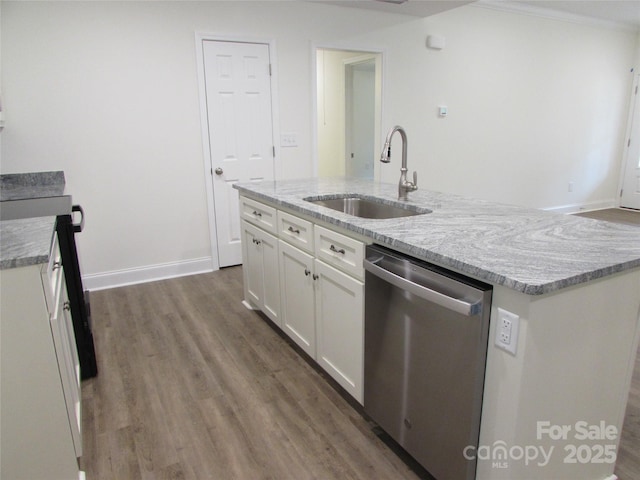 kitchen featuring light stone countertops, dishwasher, sink, a kitchen island with sink, and white cabinets