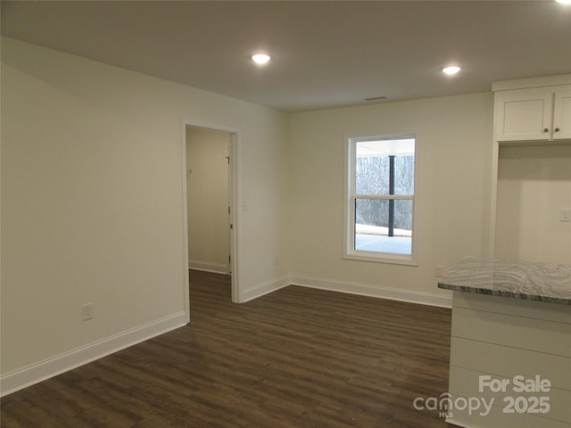 interior space with dark hardwood / wood-style flooring