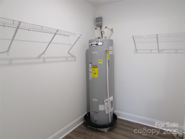 utility room with electric water heater