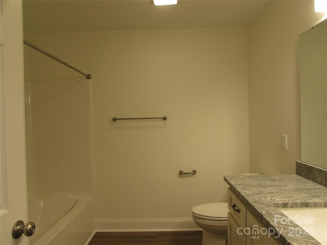 full bathroom with vanity, shower / bathtub combination, toilet, and wood-type flooring