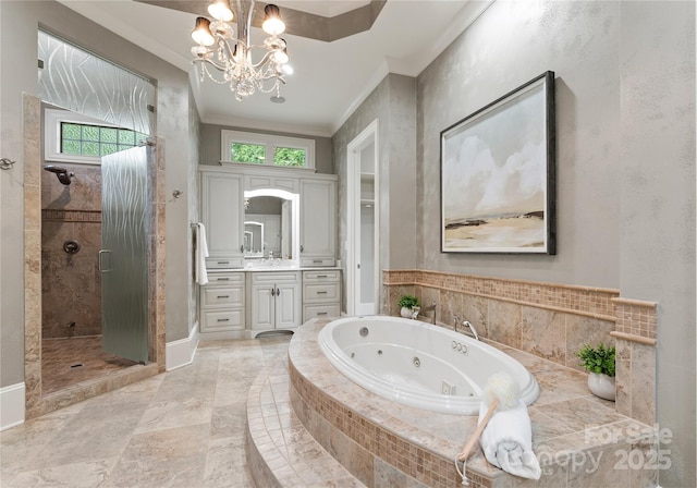 bathroom with a chandelier, shower with separate bathtub, vanity, and ornamental molding