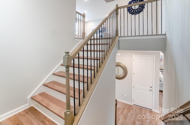 stairs with wood-type flooring