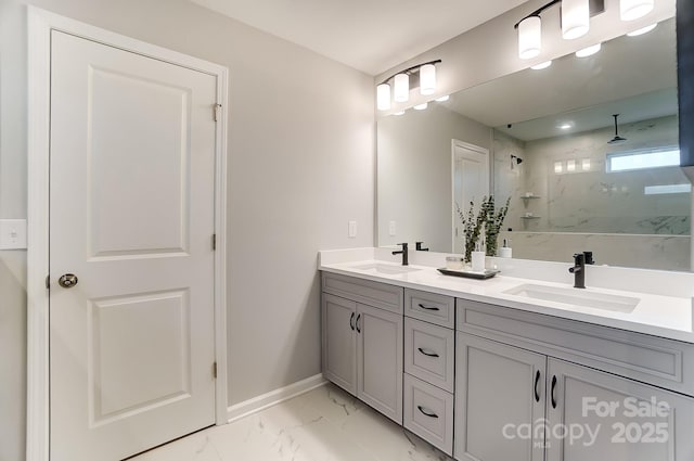 bathroom with tiled shower and vanity