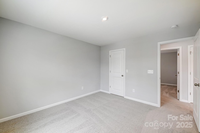 unfurnished bedroom with light colored carpet