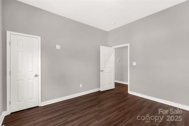 empty room featuring dark hardwood / wood-style floors