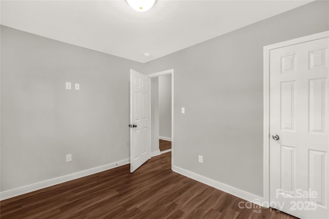 unfurnished bedroom featuring dark hardwood / wood-style floors