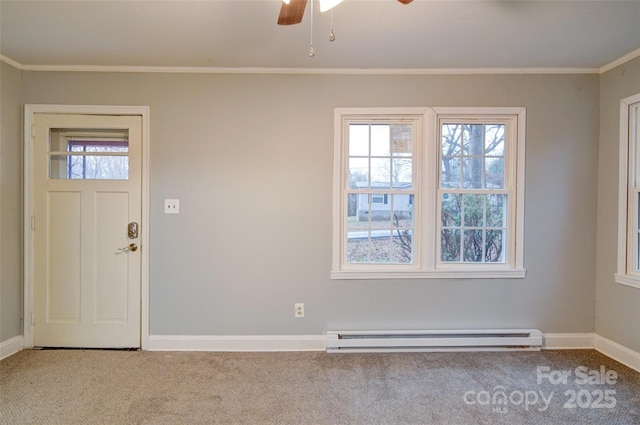 carpeted entryway featuring ceiling fan, ornamental molding, and a baseboard heating unit