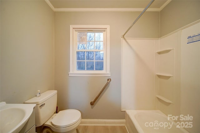 full bathroom with ornamental molding, sink, wood-type flooring, washtub / shower combination, and toilet